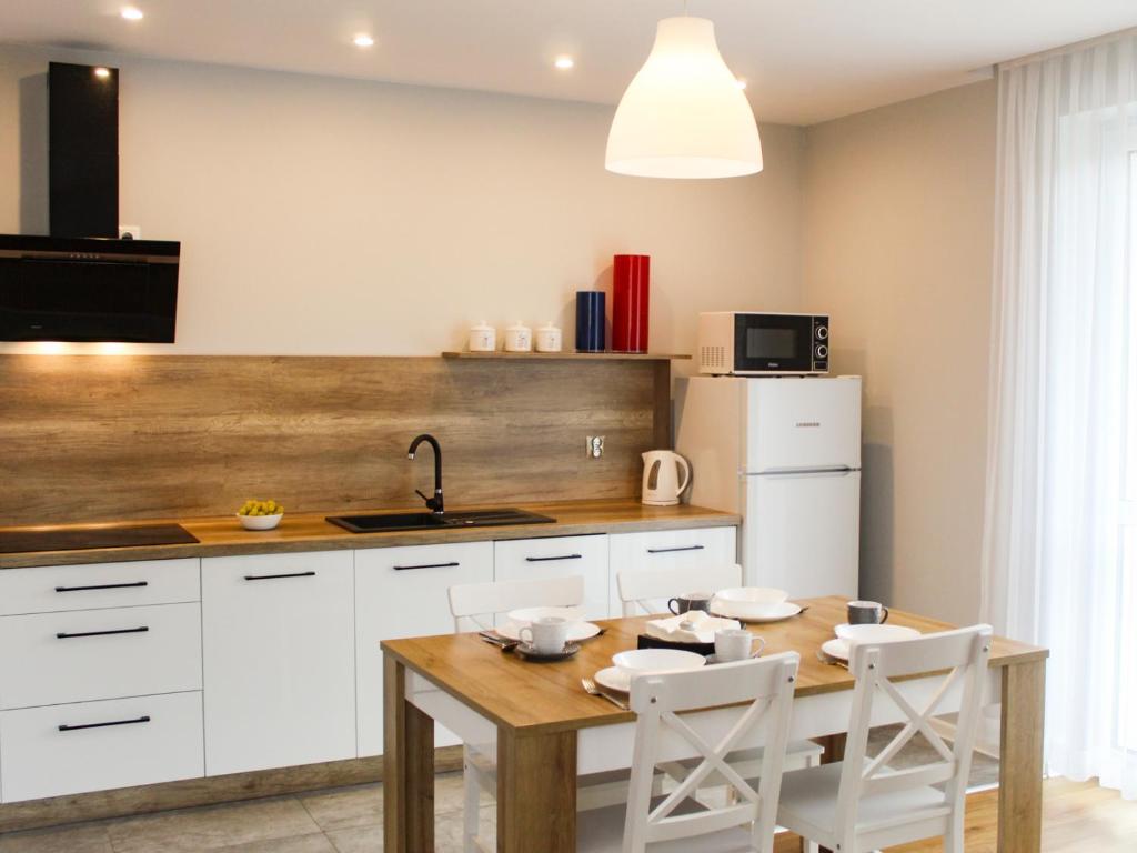 Kuchyň nebo kuchyňský kout v ubytování Apartamenty Szarotka