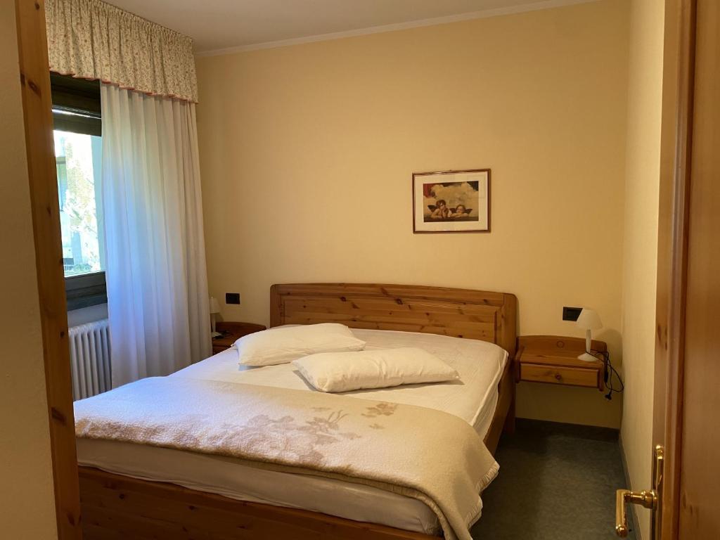 Postel nebo postele na pokoji v ubytování Condominio Gaiolin