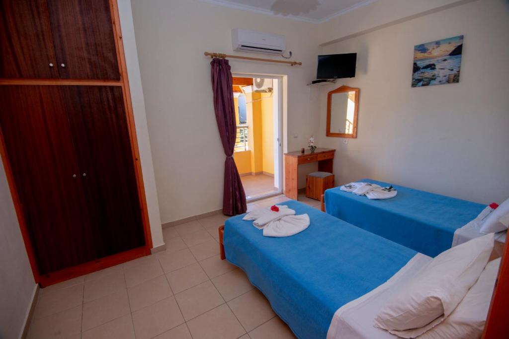 Postel nebo postele na pokoji v ubytování John Apartments First Floor