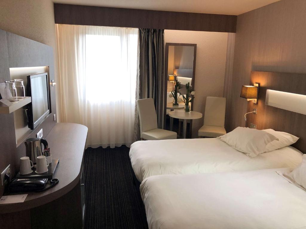 Postel nebo postele na pokoji v ubytování Best Western Marseille Aeroport