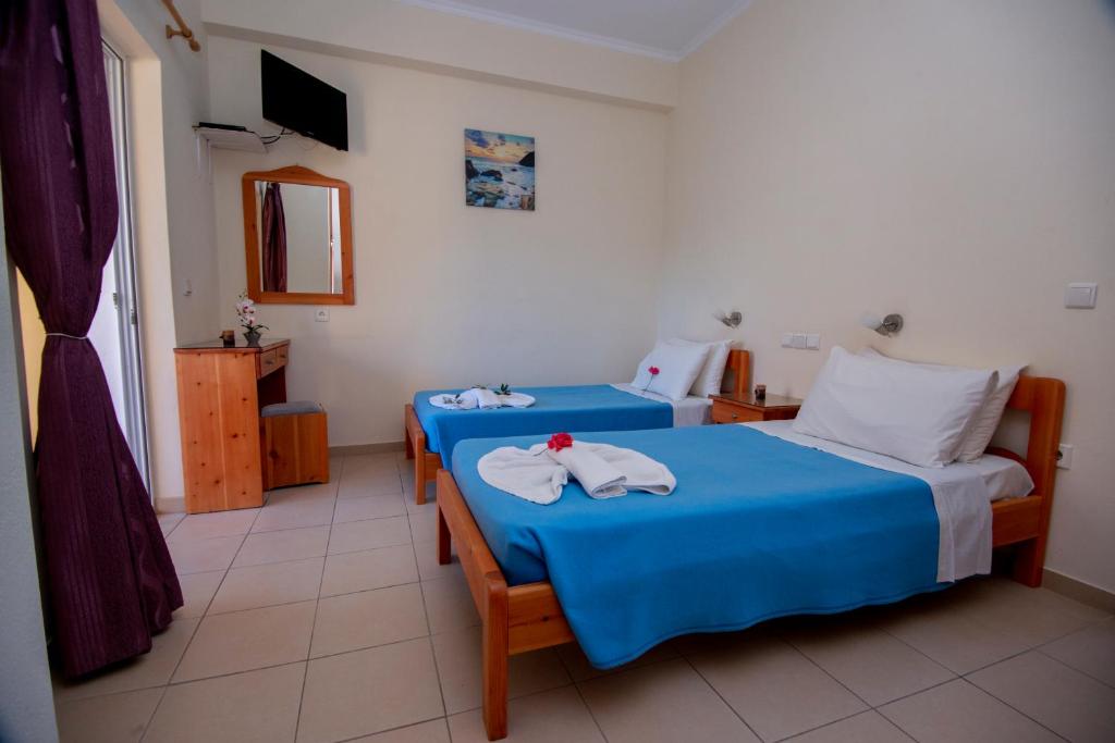Postel nebo postele na pokoji v ubytování John Apartments First Floor