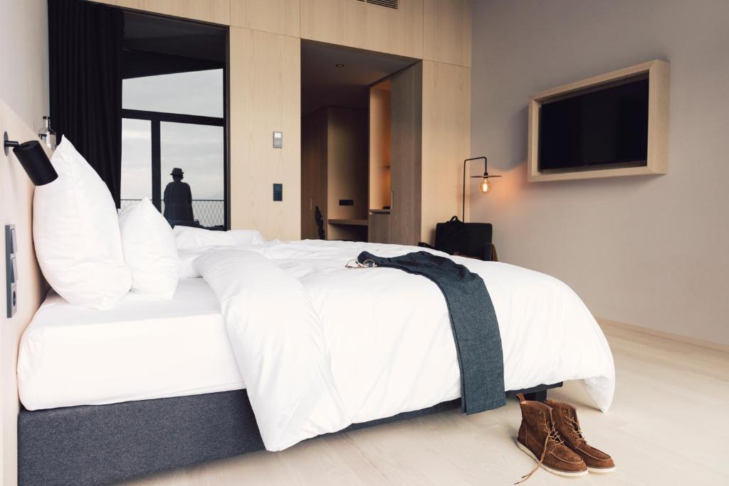 Postel nebo postele na pokoji v ubytování Hotel Milla Montis