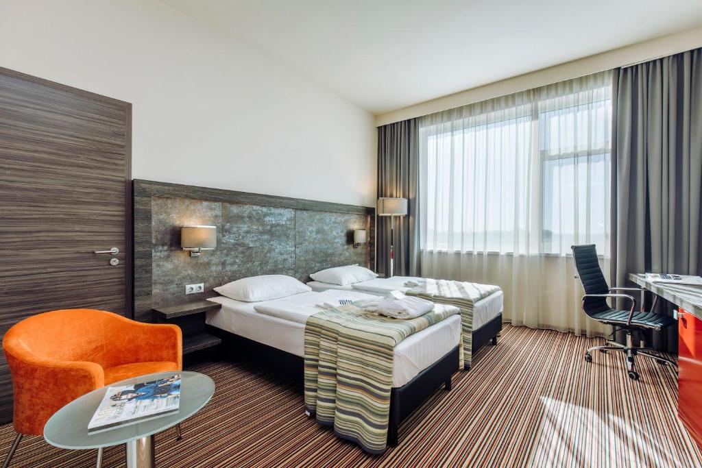 Posteľ alebo postele v izbe v ubytovaní ETO Park Hotel Business & Stadium