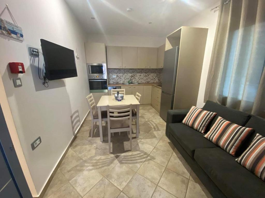Televízia a/alebo spoločenská miestnosť v ubytovaní Dream Houses