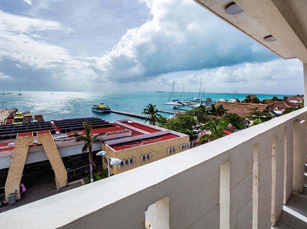 a view of the ocean from the balcony of a building at Hotel D Gomar in Isla Mujeres