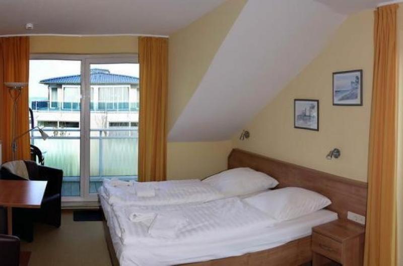 Un ou plusieurs lits dans un hébergement de l'établissement Yachthafenresidenz-Wohnung-5305-739