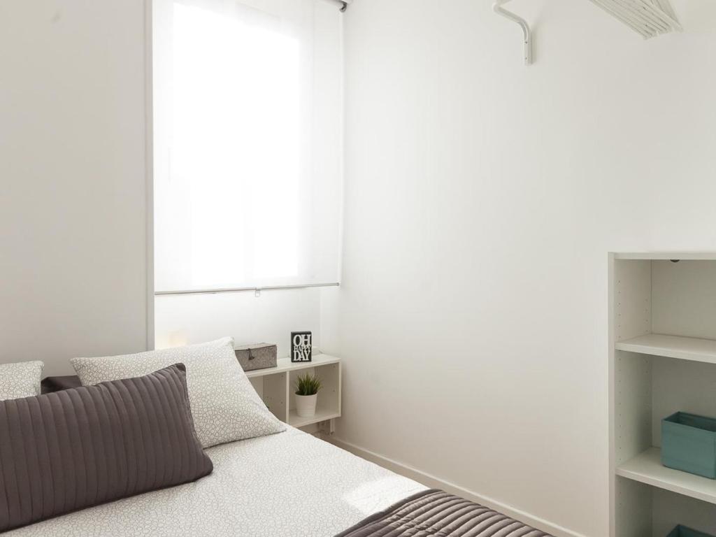 Postel nebo postele na pokoji v ubytování Lets holidays apartment in Sant Martí