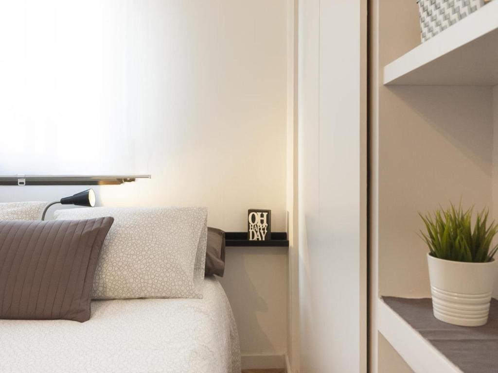 Postel nebo postele na pokoji v ubytování Lets holidays apartment in Sant Martí