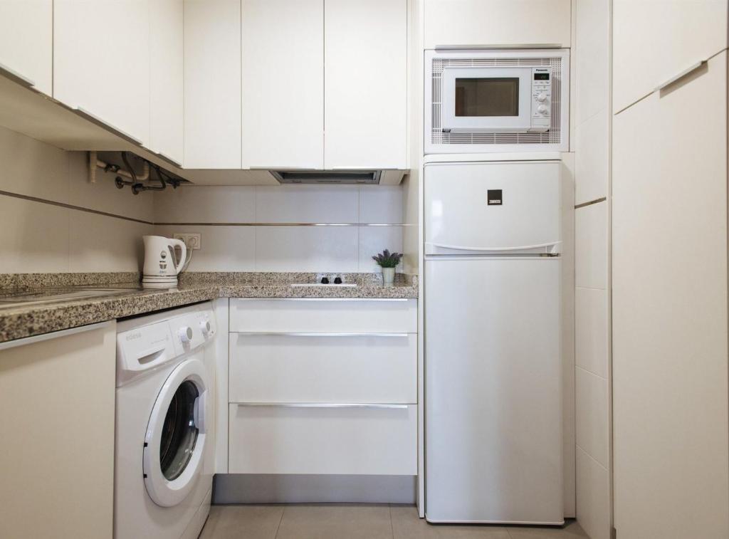 A kitchen or kitchenette at Torneo Suite Apartment