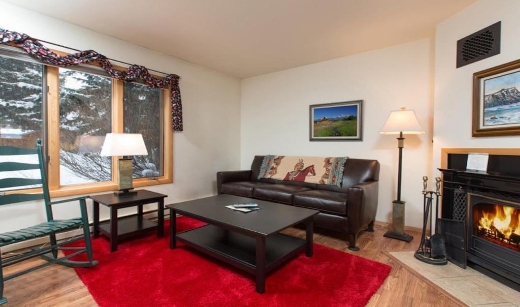a living room with a couch and a fireplace at 515 Cache in Jackson