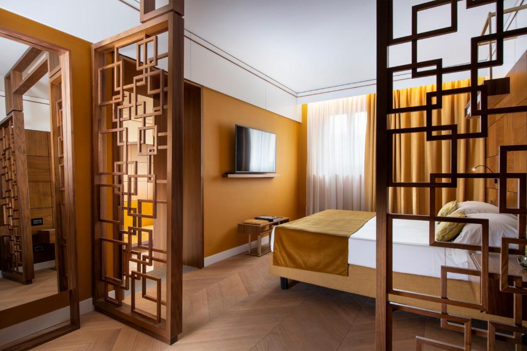 Postel nebo postele na pokoji v ubytování Hotel degli Orafi