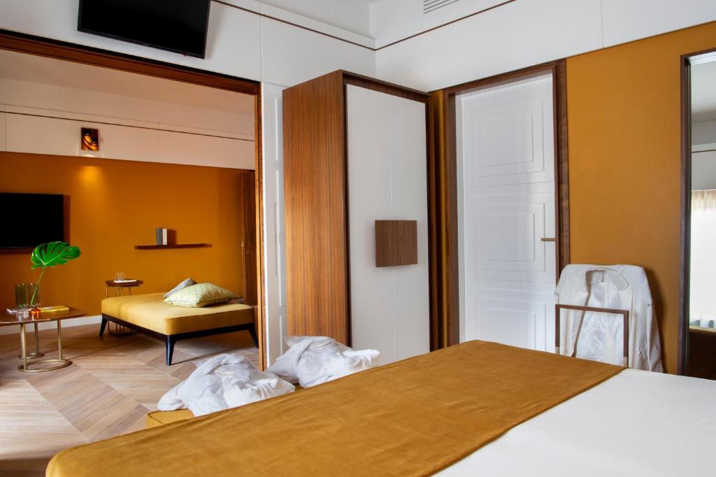 Postel nebo postele na pokoji v ubytování Hotel degli Orafi