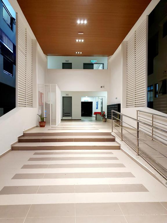 an empty hallway of a building with stairs at A29 Benoni Garden Suites in Papar