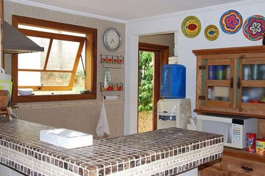  Casa com 4 suítes a 200 metros da Rua das Pedras