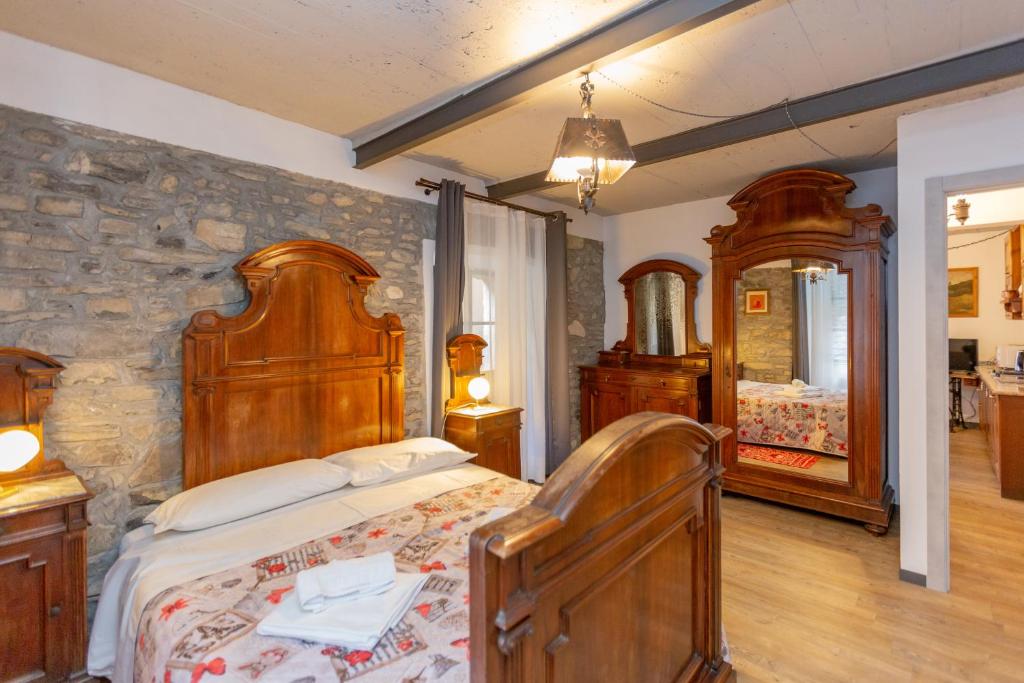 A bed or beds in a room at Vecchia Perledo 1907