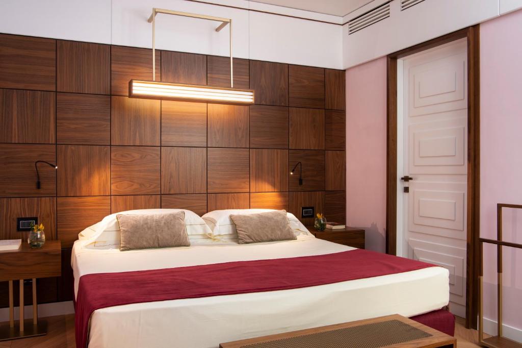 Postel nebo postele na pokoji v ubytování Hotel degli Orafi