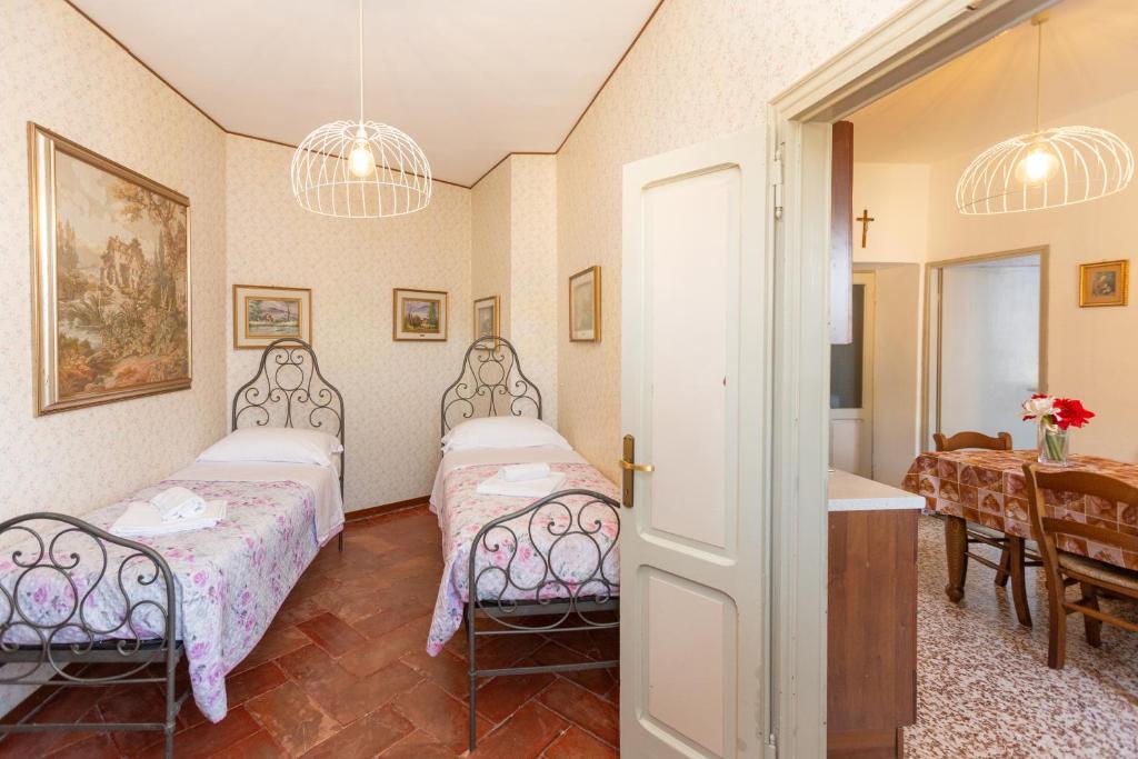 A bed or beds in a room at Vecchia Perledo 1907