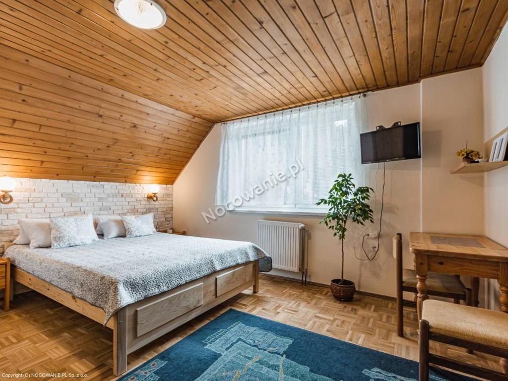 Postel nebo postele na pokoji v ubytování Penzion u Laca