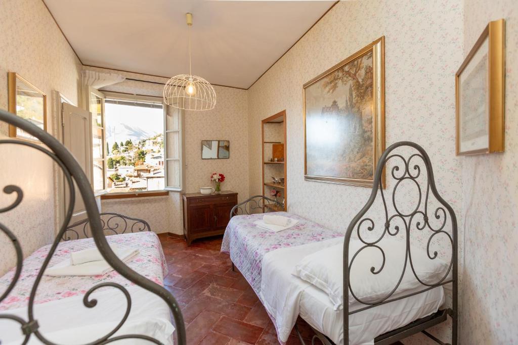 A bed or beds in a room at Vecchia Perledo 1907