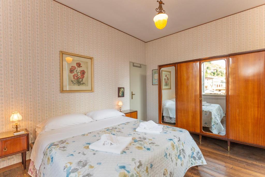 A bed or beds in a room at Vecchia Perledo 1907
