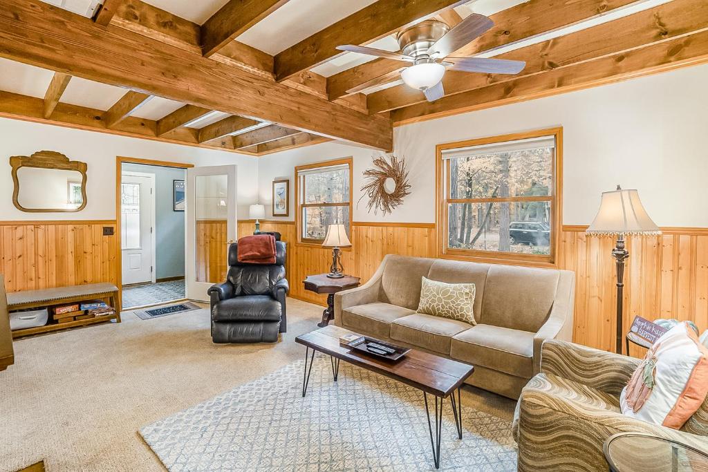 a living room with a couch and a table at Saltbox in Thompsonville