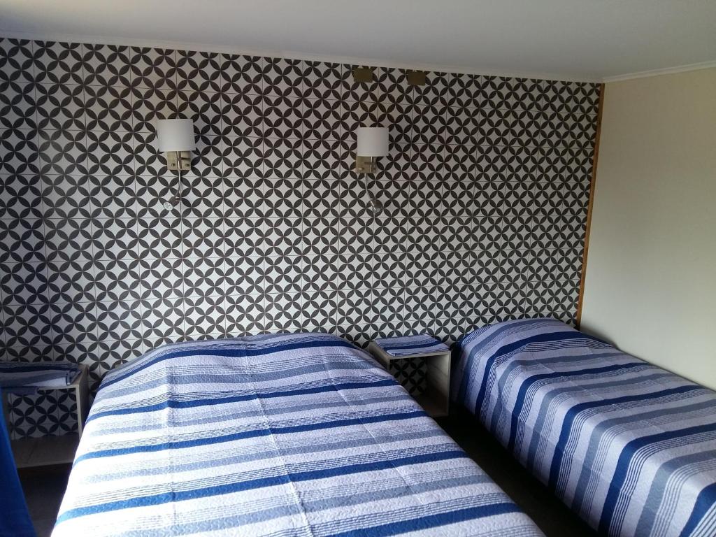 Postel nebo postele na pokoji v ubytování Lodging Quirinal