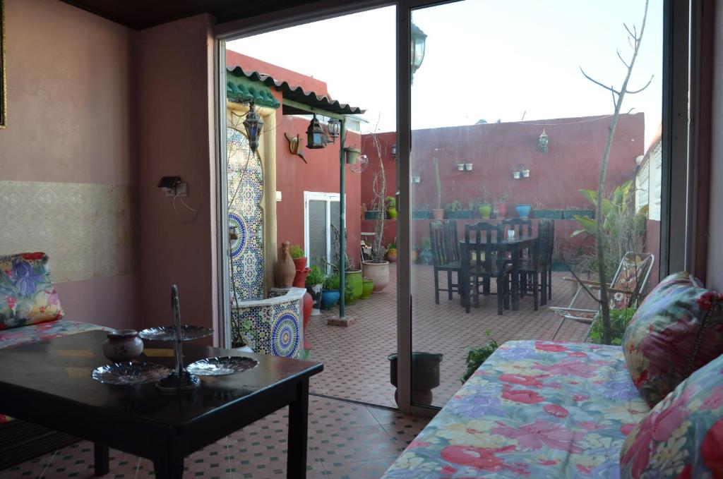 a living room with a view of a patio at riad kamal in Rabat