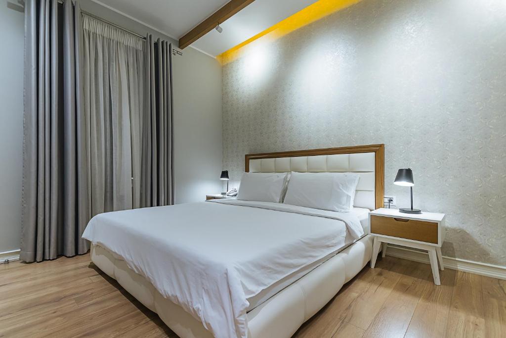 Postel nebo postele na pokoji v ubytování Villa Ester