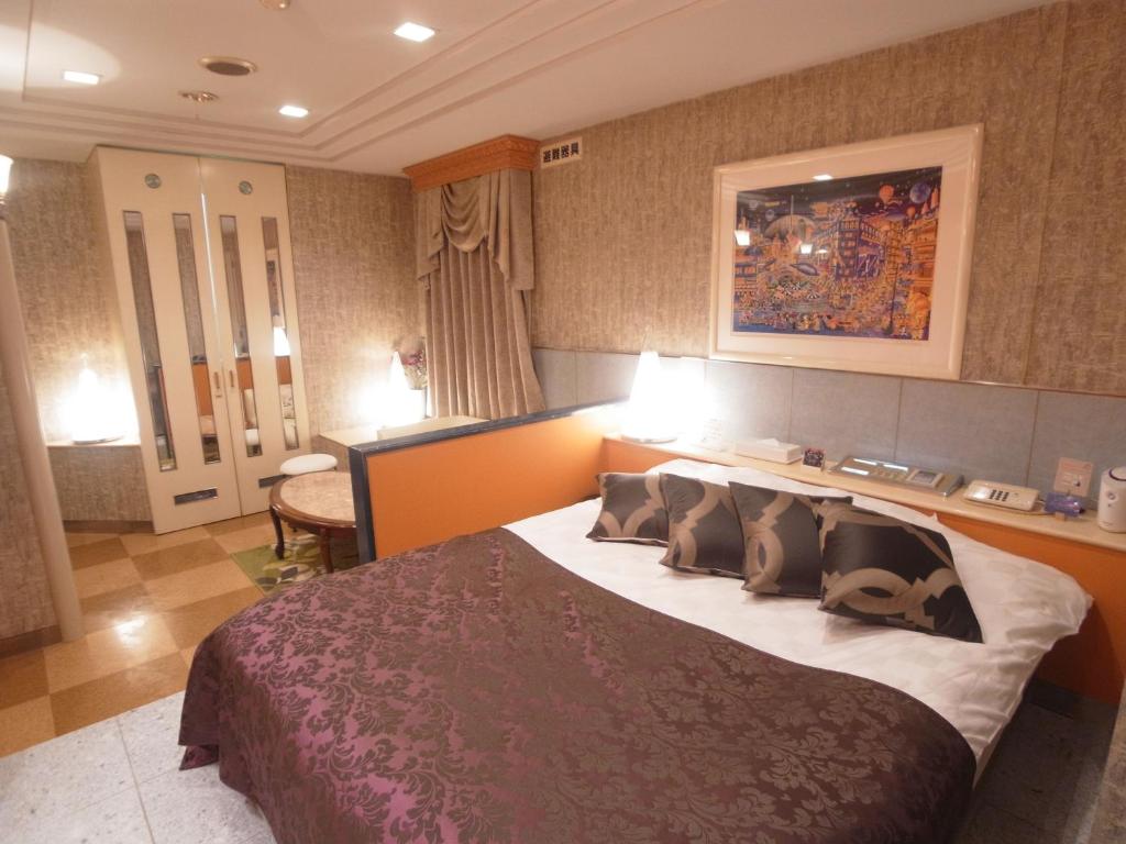 Postel nebo postele na pokoji v ubytování Hotel VINO Adult Only