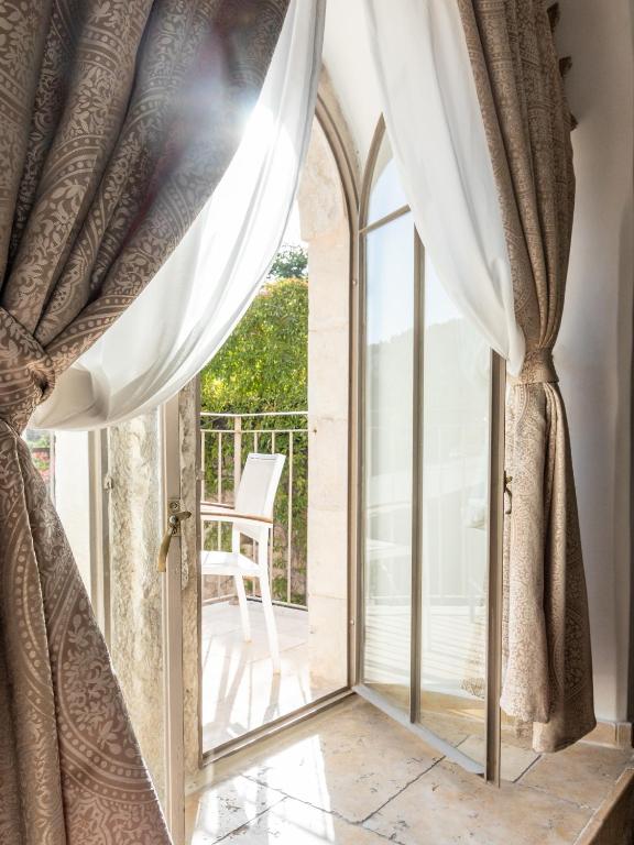 Balkón nebo terasa v ubytování Flora Valley Boutique Hotel
