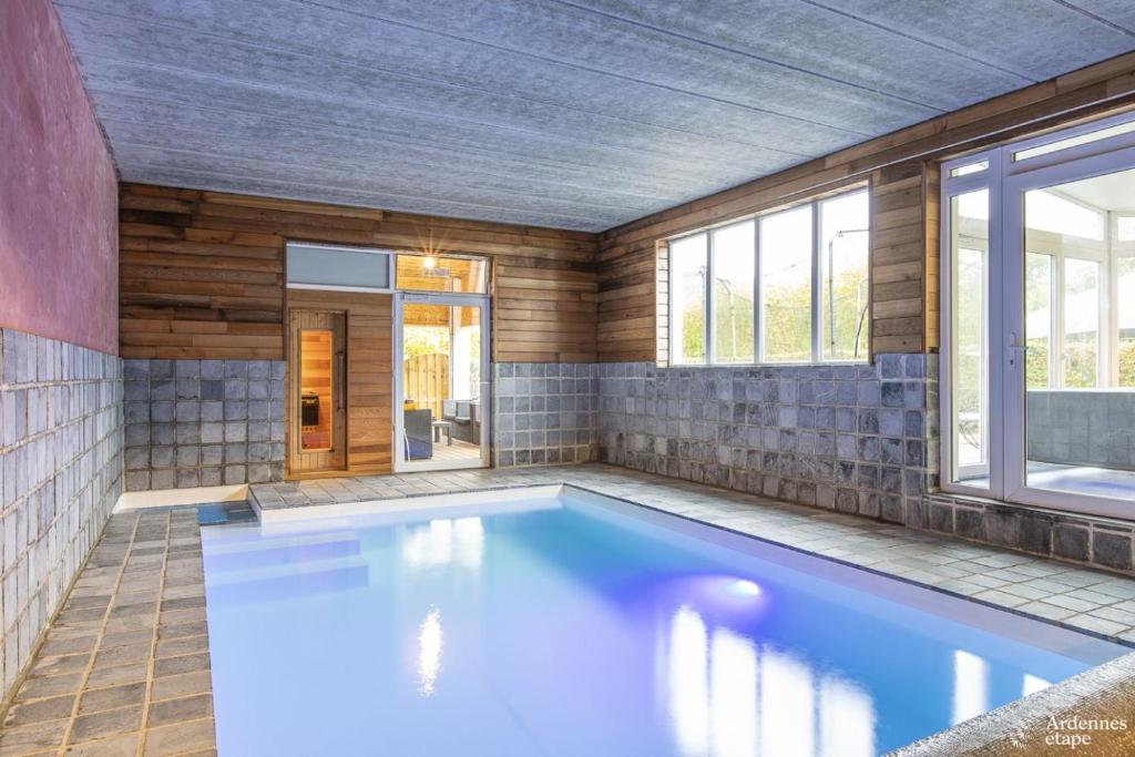 a large swimming pool in a house at Les Bastinettes in Stoumont