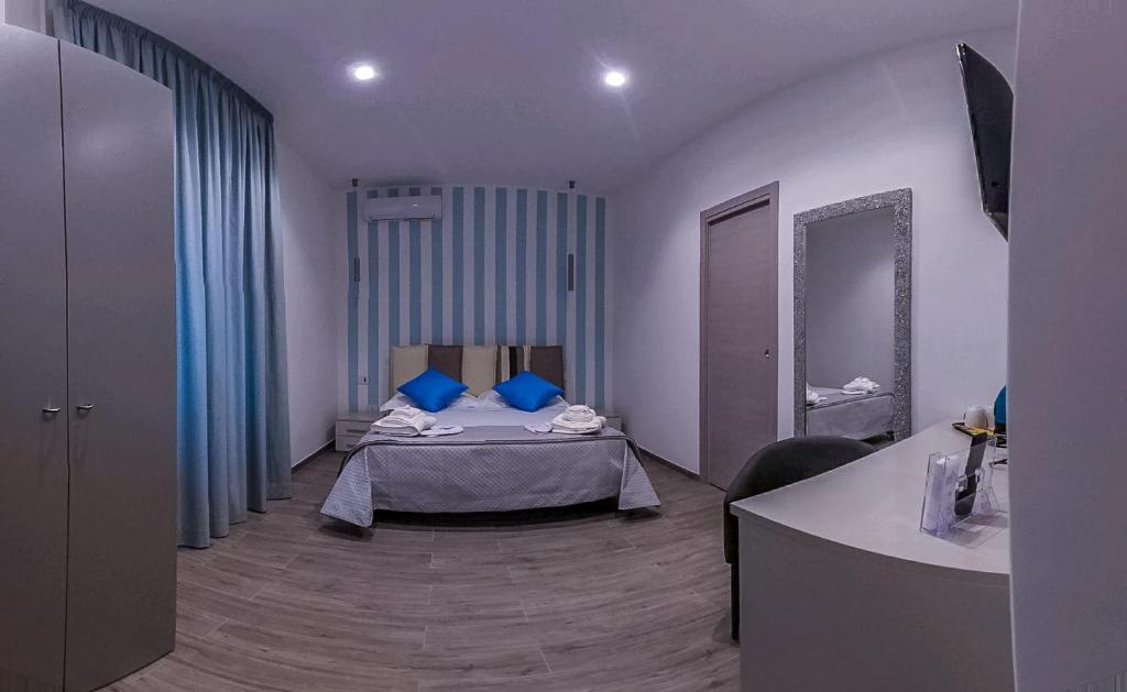 Postel nebo postele na pokoji v ubytování Le Origini Rooms&Suite