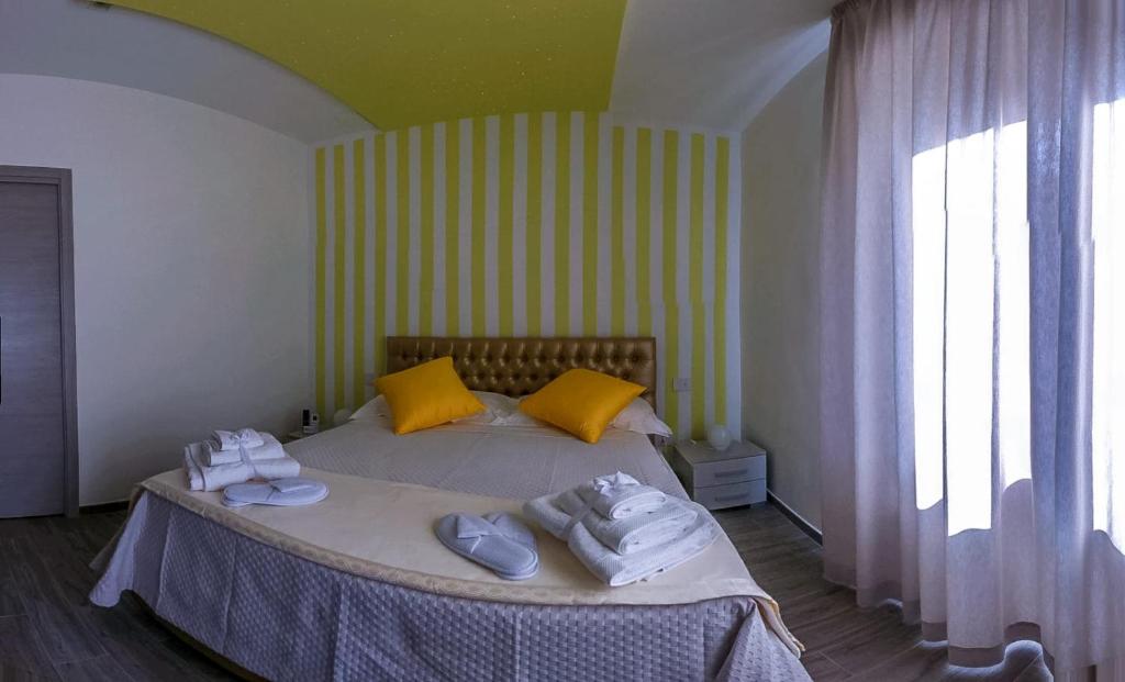 Postel nebo postele na pokoji v ubytování Le Origini Rooms&Suite