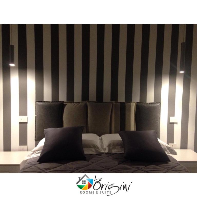 Postel nebo postele na pokoji v ubytování Le Origini Rooms&Suite