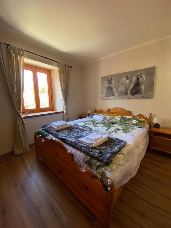 A bed or beds in a room at San Marco FARMHOUSE with a view.