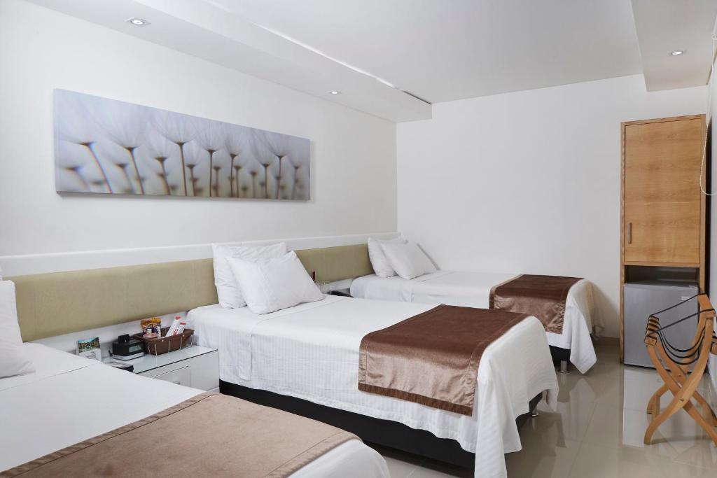 Postel nebo postele na pokoji v ubytování Hotel Zona A