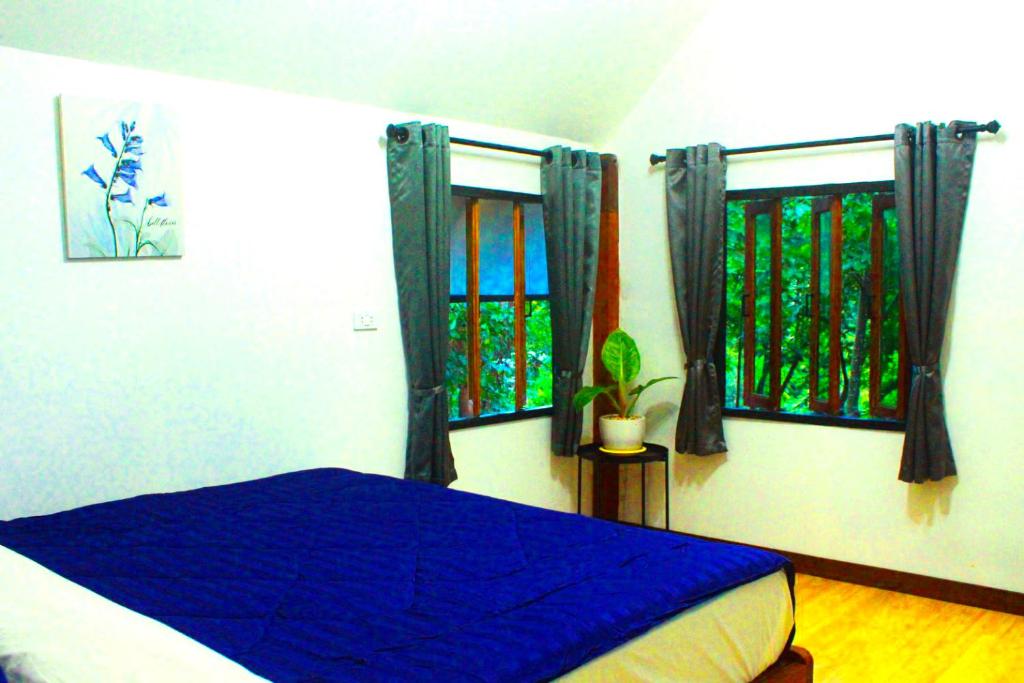 Postel nebo postele na pokoji v ubytování Jungle guest house