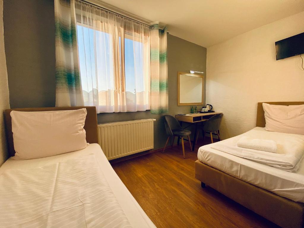 Postel nebo postele na pokoji v ubytování Zajazd Chata Staropolska