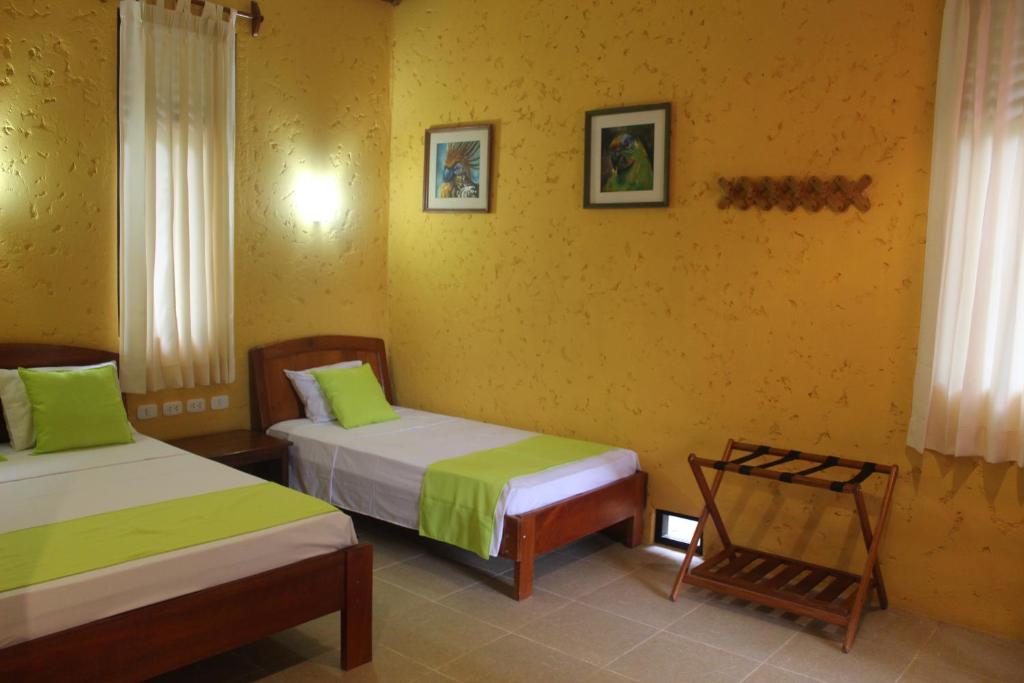 Postel nebo postele na pokoji v ubytování Cordillera Escalera Lodge