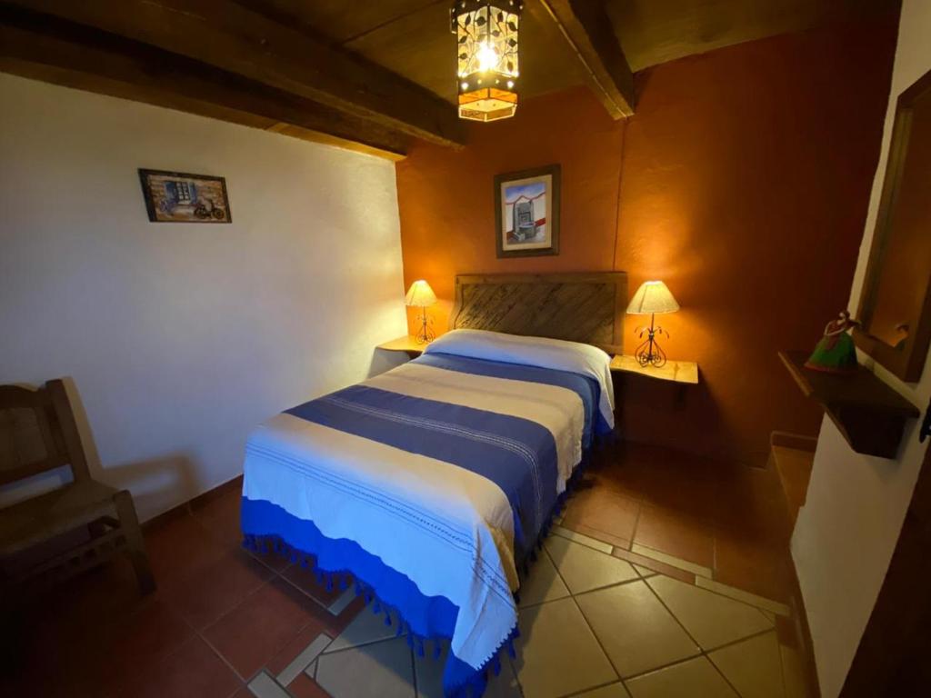 Postel nebo postele na pokoji v ubytování Hotel Mi Pueblito Tapalpa