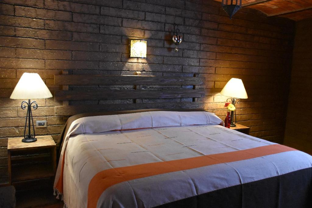 Postel nebo postele na pokoji v ubytování Hotel Mi Pueblito Tapalpa