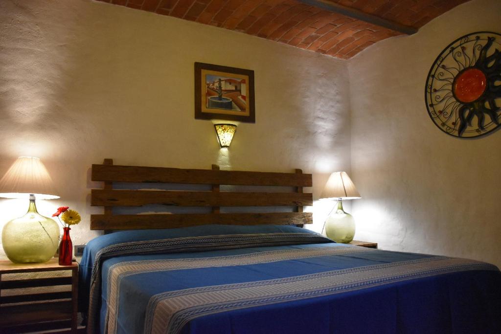 Postel nebo postele na pokoji v ubytování Hotel Mi Pueblito Tapalpa