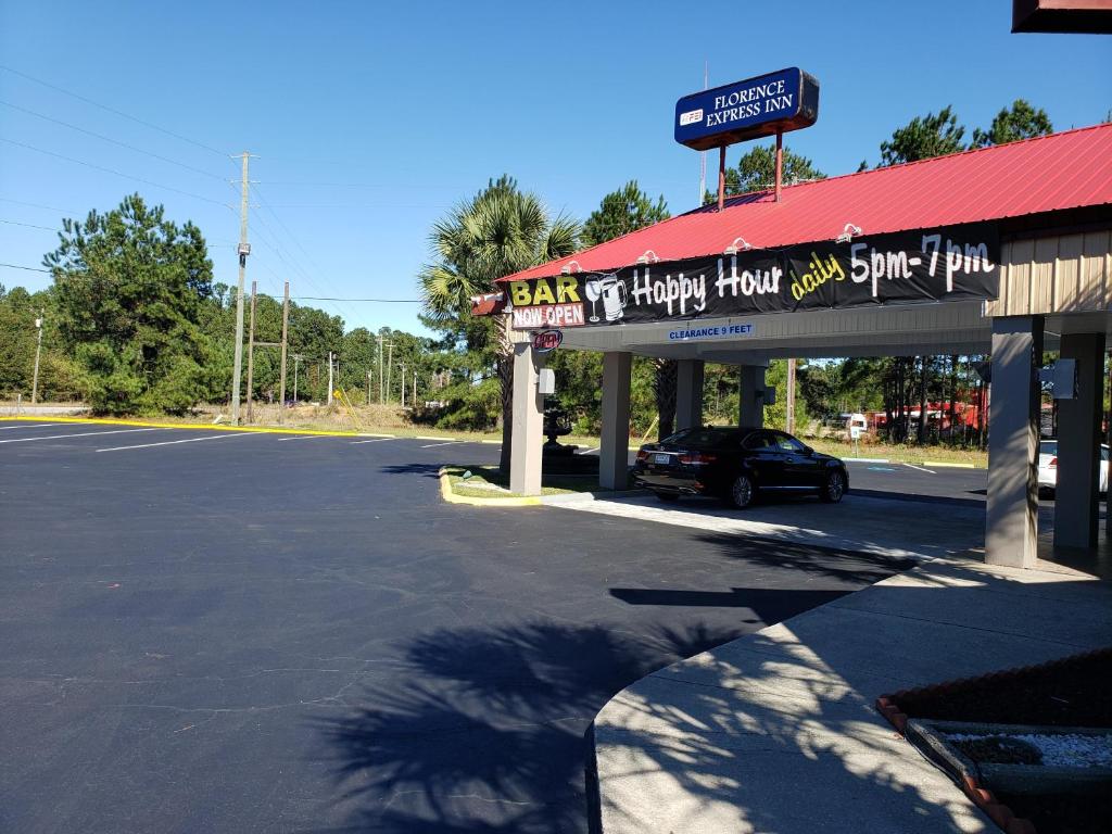 a car parked in front of a gas station at Florence Express Inn in Florence