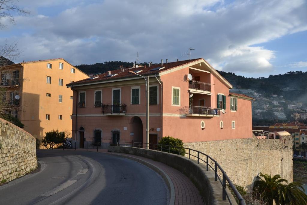 a building on the side of a road at B&B Torre Porta Marina in Ventimiglia