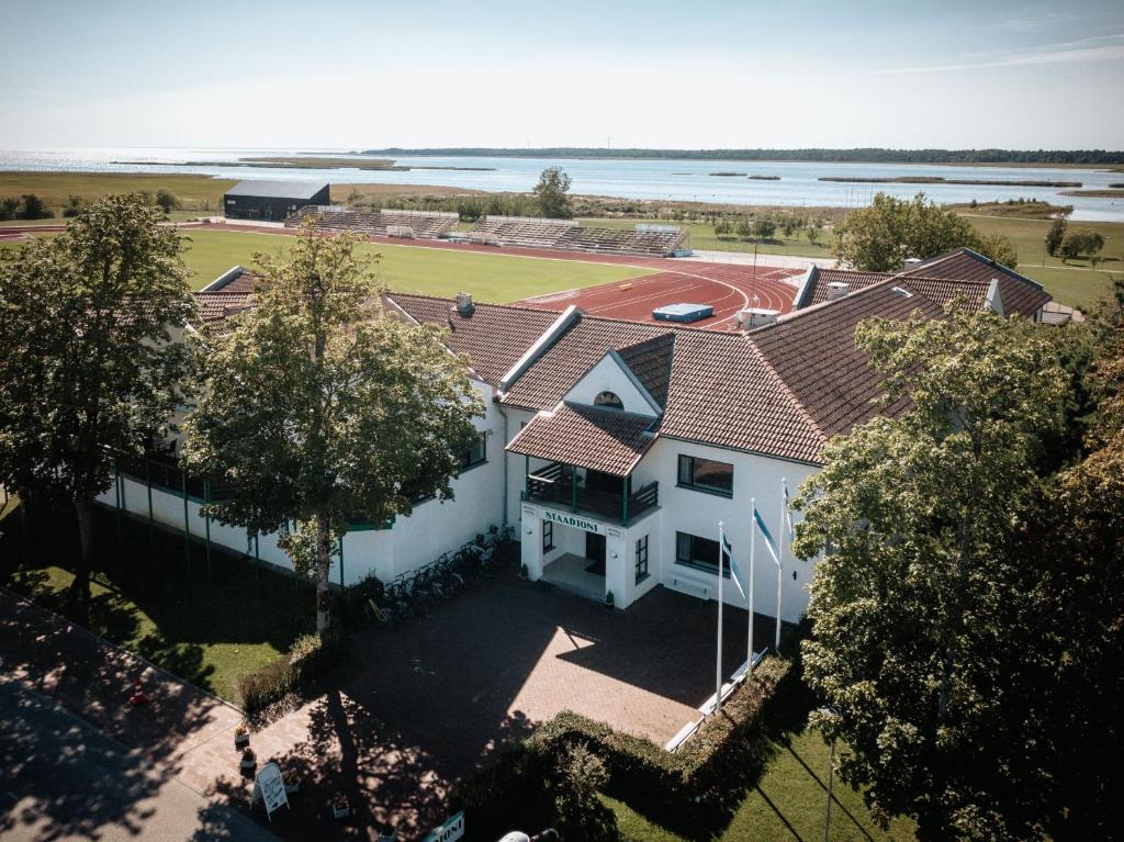 an overhead view of a white house with a red roof at Staadioni Hotel in Kuressaare