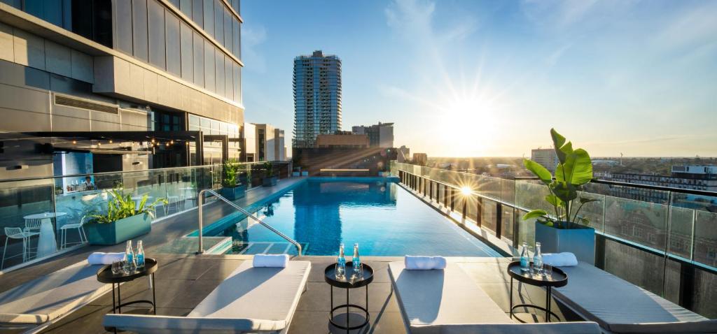 a swimming pool on the roof of a building at Crowne Plaza Adelaide by IHG in Adelaide