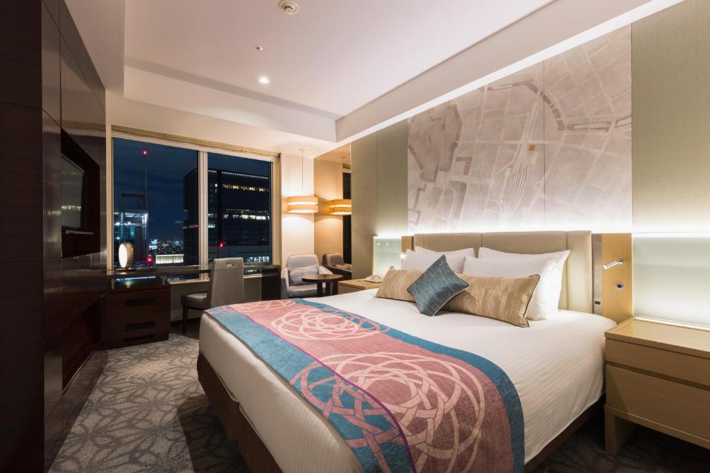 Postel nebo postele na pokoji v ubytování Hotel Metropolitan Tokyo Marunouchi
