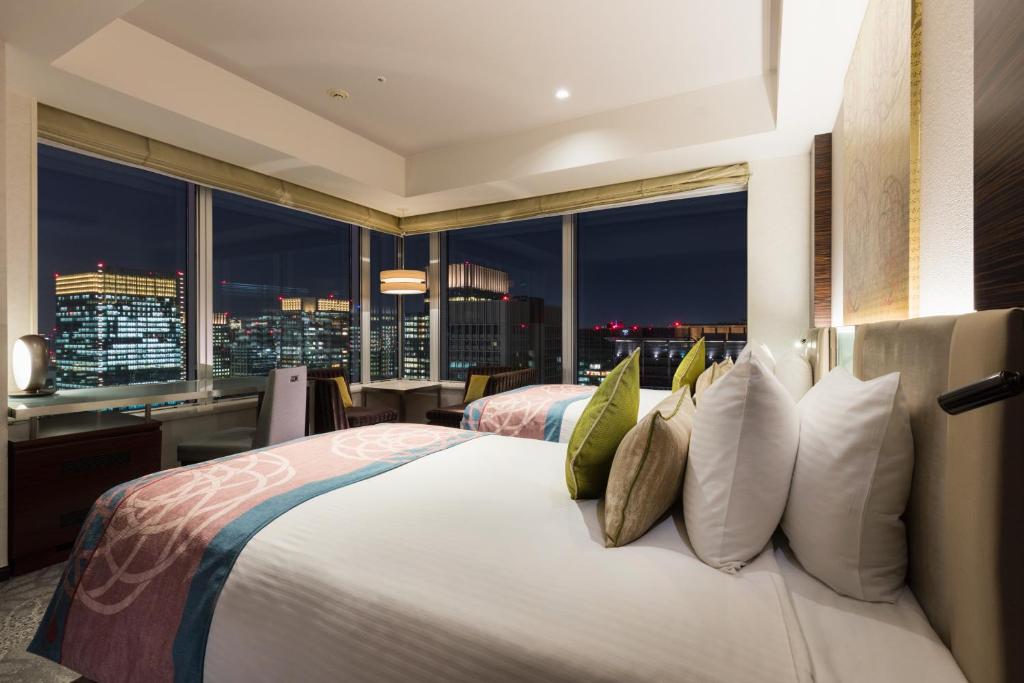 Postel nebo postele na pokoji v ubytování Hotel Metropolitan Tokyo Marunouchi