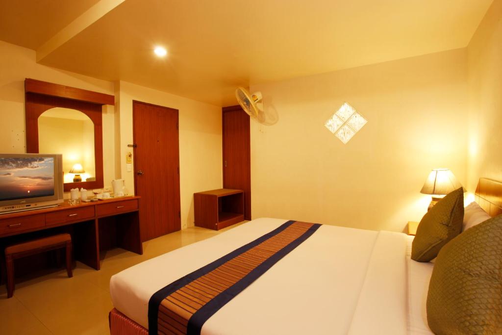 Postel nebo postele na pokoji v ubytování Orchid Resortel