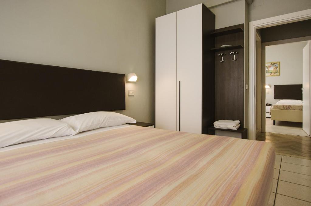 Postel nebo postele na pokoji v ubytování Hotel Milena